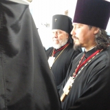 Bishop Irénée and Fr. Nazari waiting to have a  glass of wine with the Patriarch in the summer house
