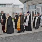 Archbishop Irenée and Clergy process out of church with casket of Father Alexander.jpg