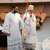 Archbishop Irenée censes Icons with Protodeacon Jesse Isaac.jpg