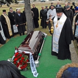 Archbishop Irenée censes the remains of Archimandrite Alexander surrounded by clergy