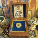 The relic of St. Nikolai, housed in a small wooden reliquary, a gift from Archbishop Lazar and the Monastery of All Saints of North America