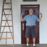 Kai celebrating the successful mounting of the icon of Christ above the door of the Mission