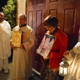 The Parish President Karen Davis holds the icon of the Resurrection