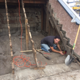 Jacking Sagging Wall into Place