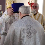 Archbishop Irénée grants the award of the Kamilavka to Priest Leonard Herrem